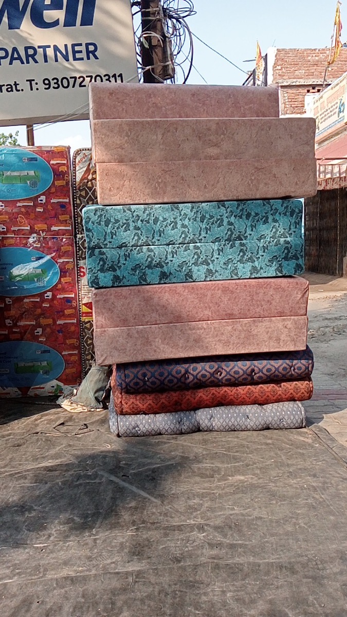 Range of foam and cotton gadde outside Shukla Gadda Samrat shop, Juhi Kanpur